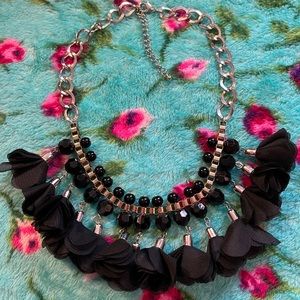 Gold and silver necklace with black fabric puffs